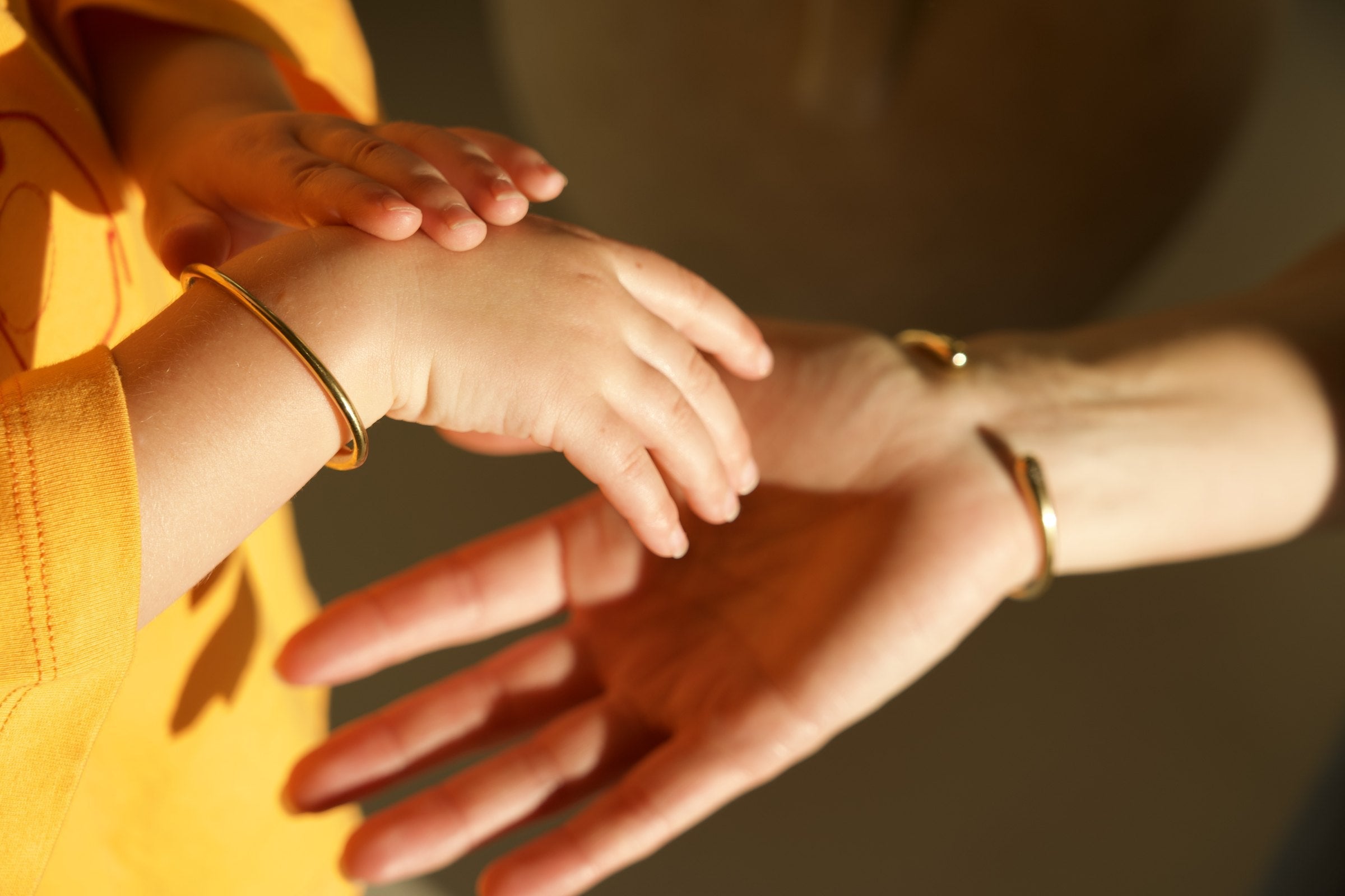 Mum and bub wearing Boo Bracelets