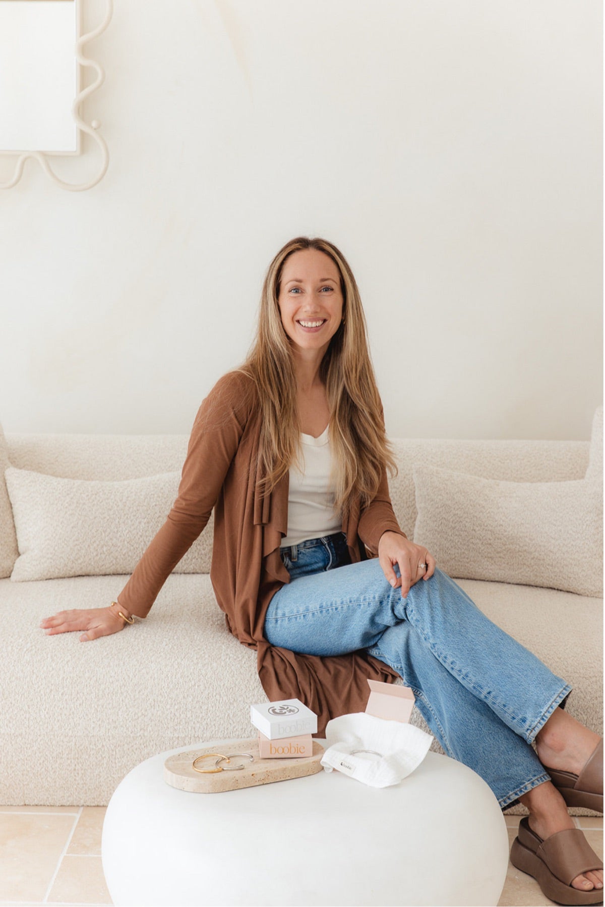Grace, founder of Boobie Bracelet, at home