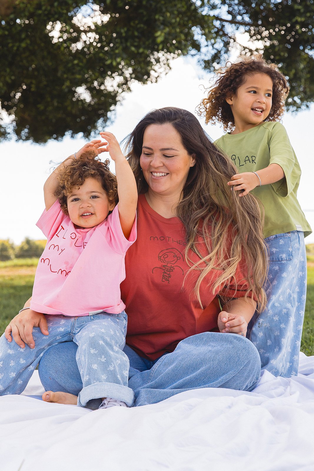 A mum and her children in Momenta tees